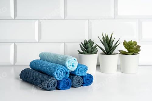 Preview: Colorful microfiber towels on a modern kitchen. Kitchen utensils