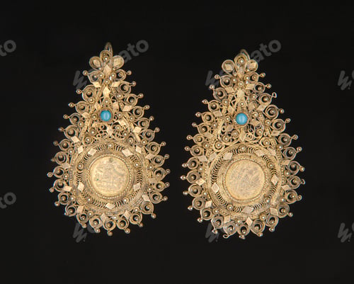 Preview: Vintage, central Asian earrings with precious stones isolated on a black background