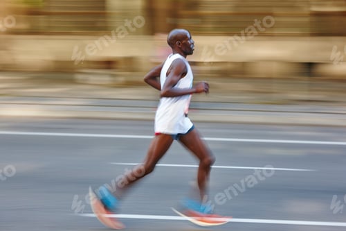 Preview: Marathon runner in motion on the street. Healthy lifestyle.