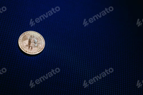 Preview: Golden bitcoin coin isolated on blue dark background