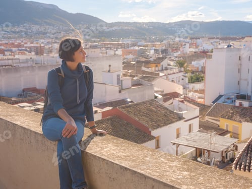 Preview: Young woman exploring historic castle in Denia