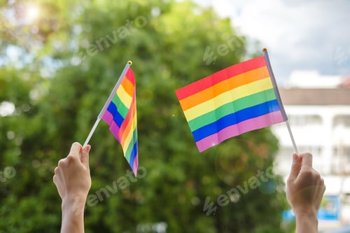 Vista previa: hands showing LGBTQ Rainbow flag. Lesbian, Gay, Bisexual, Transgender and Queer community and Pride