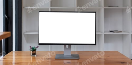 Preview: Close up view of simple workspace with open blank screen laptop, frame and notebook on white table