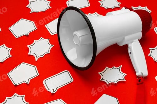 Preview: Electronic megaphone with speech bubble on red background
