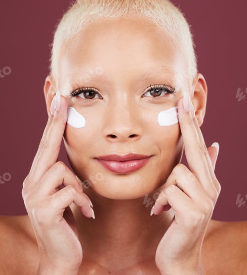 Preview: Skincare, beauty and portrait of woman putting cream on face, cosmetics and makeup on studio backgr