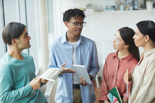 Preview: African man talking to his colleagues