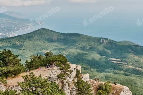 Preview: Crimean mountains. Tourists on the observation deck of the Ai Petri plateau.