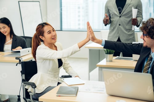 Preview: Successful businesspeople working at office desk.