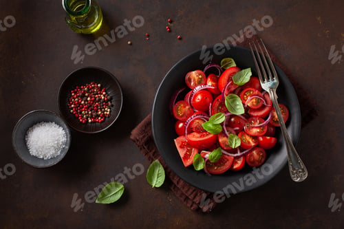 Preview: healthy tomato salad with onion basil olive oil and balsamic vinegar