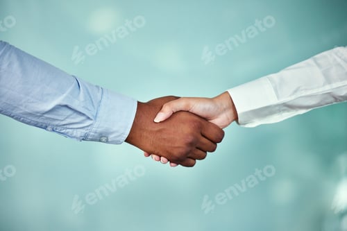 Preview: Cropped shot of two unrecognizable businesspeople shaking hands against a blue background