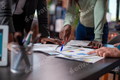 Preview: Group of people reading financial charts