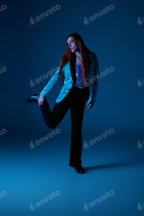 Preview: Bold expression of pride through vibrant fashion and confident pose during an artistic photoshoot