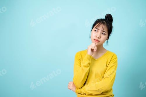 Preview: Young Woman poses suspiciously in the studio concept