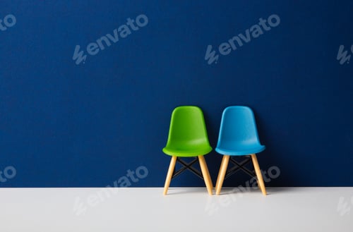 Preview: Two chairs against a blue wall. Business Concept