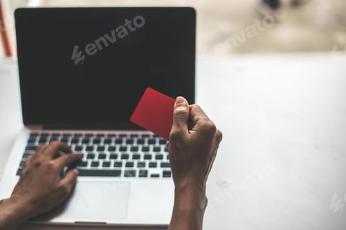 Preview: Businesswoman sitting at the computer and makes online shopping in office. Business E Commerce.