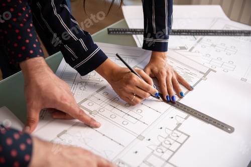 Preview: Close up with the hands of two architects who draw something in a house plan