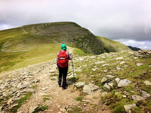 Preview: Woman walking on the mountain, cold weather