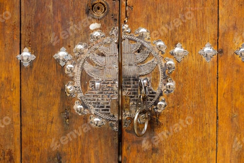 Preview: Metallic door knob with wooden door