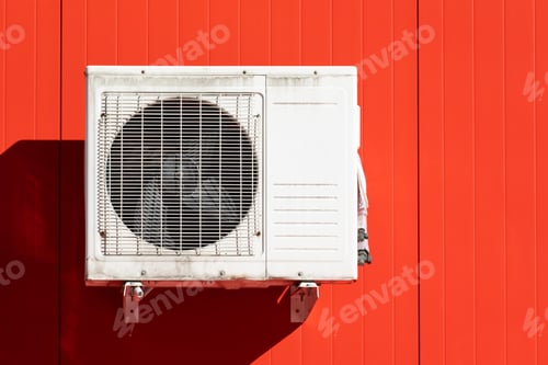 Preview: outdoor air conditioner unit on the wall of a building