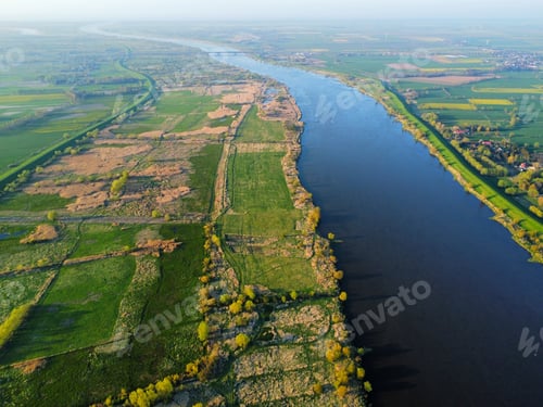 Preview: Aerial view of a river in green field