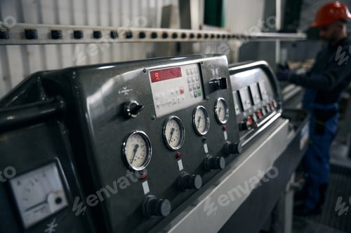 Preview: Worker operating machinery in an industrial factory setting