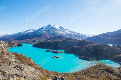 Turquoise Lake Surrounded by Rocky Mountains and Wilderness