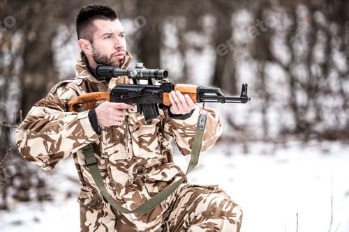 Preview: Guard military man holding a gun and protecting ground during operation