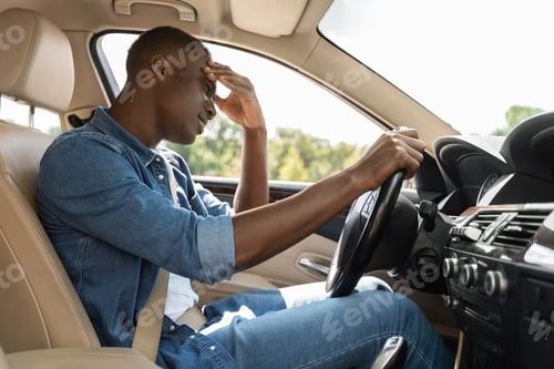 Preview: Stressed african american guy stuck in car traffic