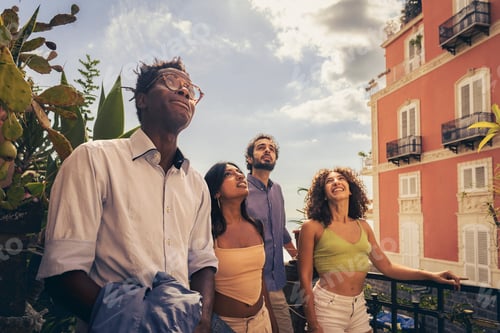 Preview: Friends enjoying a sunny day on the rooftop, gazing at the clouds and sharing laughter