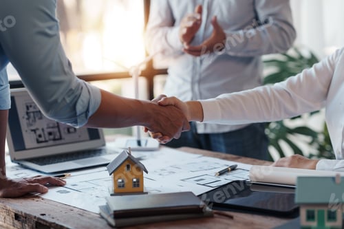 Preview: Architect and engineer work together and shaking hands to welcome home design projects to work