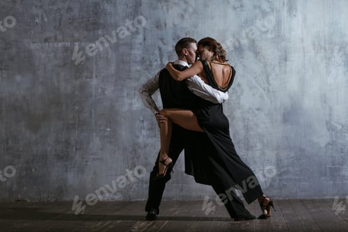 Preview: Man and woman in black dress dance tango