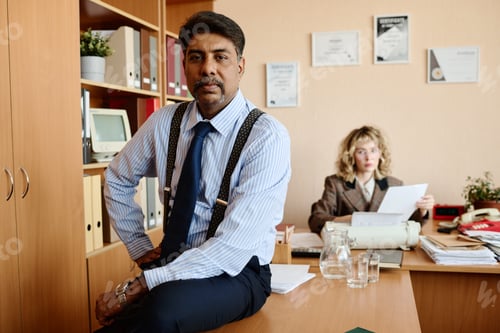 Preview: Businessman Posing Confidently in Office Setting