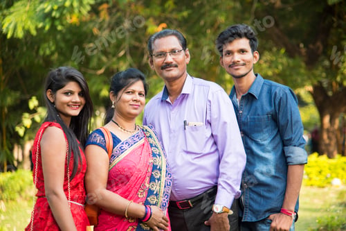Preview: Happy Indian family at outdoors, Enjoying holiday in park.