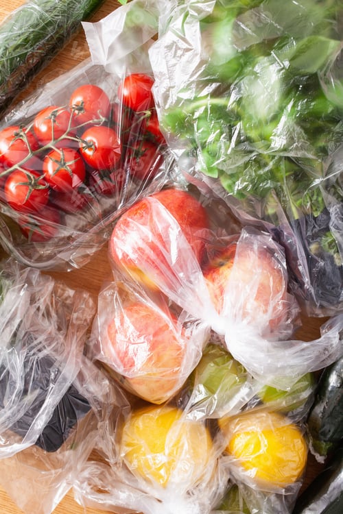 Preview: single use plastic waste issue. fruits and vegetables in plastic bags