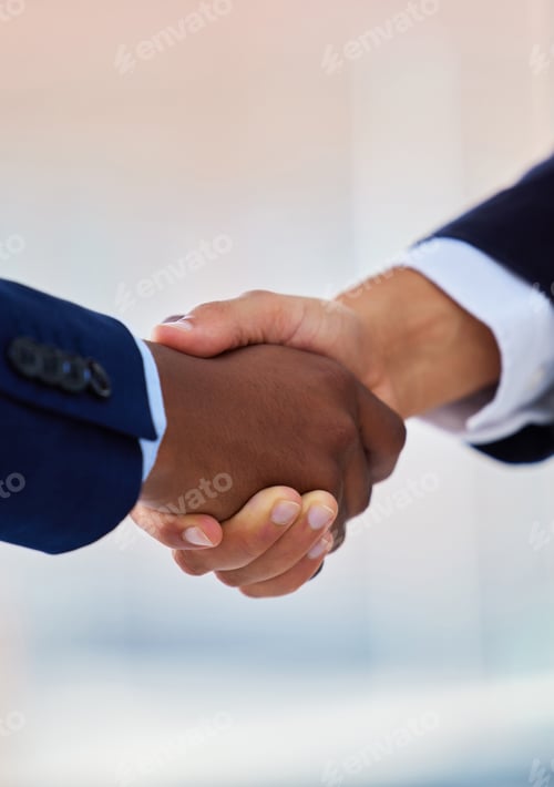 Preview: Shot of two unrecognisable businessmen shaking hands in a modern office