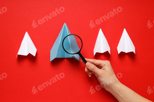 Preview: Business, startup and sponsorship concept with paper planes on red background