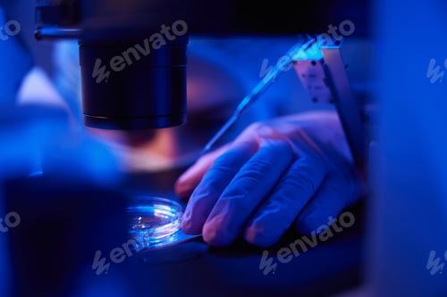 Preview: Experienced laboratory scientist preparing for cell micromanipulation