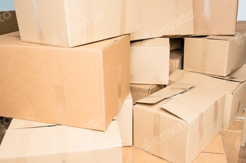 Preview: Detail of many cardboard boxes full of household items during a move.