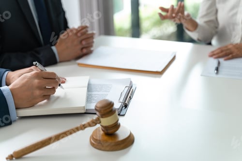 Preview: Lawyer Legal counsel presents to the client a signed contract with gavel and legal law.