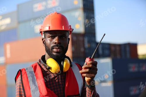 Preview: industry worker control loading containers in the container terminal