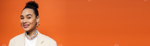 Preview: african american model with vivid makeup and hoop earrings looking and smiling at camera, banner
