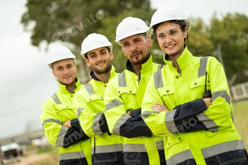 Preview: Engineer worker in arms crossed standing in a row looking smile to camera