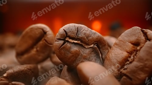 Preview: Close up of seeds of coffee. Fragrant coffee beans are roasted smoke comes from coffee beans.