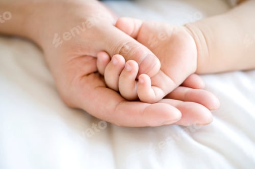 Preview: Hand holding infant hand