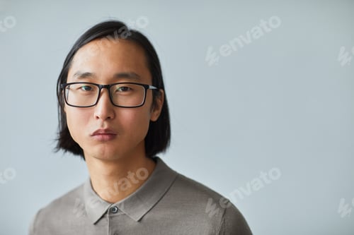 Preview: Young Man Wearing Glasses Looking at Camera