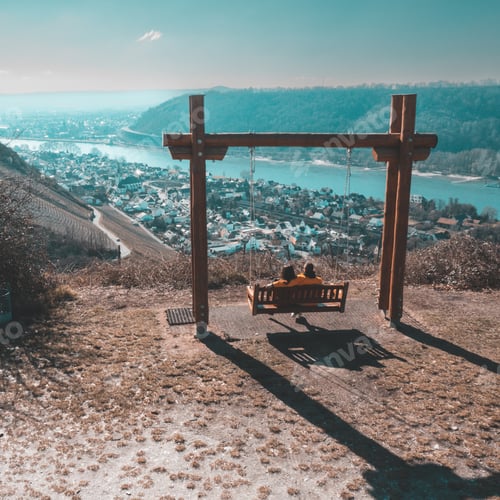 Preview: Couple on the swing enjoying the view of the city