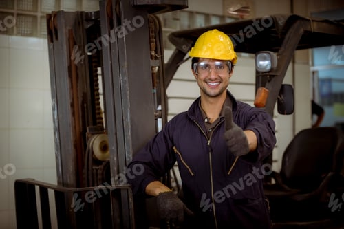 Preview: Portrait worker industry factory wear safety uniform factory drive a forklift car and open car light
