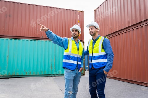 Preview: Two male engineers in a container shipping company