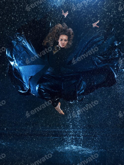 Preview: The young beautiful modern dancer dancing under water drops