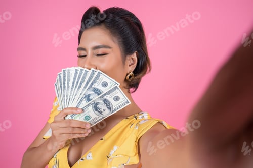 Preview: Happy Fashion beautiful woman hand holding dollar money